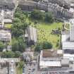 Oblique aerial view of Trinity House and South Leith Parish Church and Churchyard, looking E.