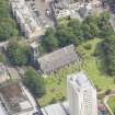 Oblique aerial view of Trinity House and South Leith Parish Church and Churchyard, looking NNE.