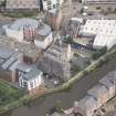 Oblique aerial view of Quayside Mills, looking NNE.