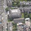 Oblique aerial view of North Leith Parish Church, Church hall and Beadle's House, looking SSE.
