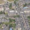 Oblique aerial view of North Leith Parish Church, Church hall and Beadle's House, looking NW.