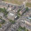 Oblique aerial view of North Leith Parish Church, Church hall and Beadle's House, looking W.