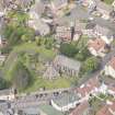 Oblique aerial view of St Triduana's Chapel, Restalrig Parish Church and Churchyard, looking NW.