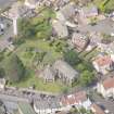 Oblique aerial view of St Triduana's Chapel, Restalrig Parish Church and Churchyard, looking WNW.