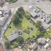 Oblique aerial view of St Triduana's Chapel, Restalrig Parish Church and Churchyard, looking S.
