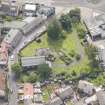 Oblique aerial view of St Triduana's Chapel, Restalrig Parish Church and Churchyard, looking SSE.