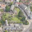 Oblique aerial view of St Triduana's Chapel, Restalrig Parish Church and Churchyard, looking E.