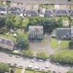 Oblique aerial view of the Roman Catholic Church of St Ninian and St Triduana and 232 Marionville Road, looking SSE.