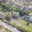 Oblique aerial view of the Roman Catholic Church of St Ninian and St Triduana and 232 Marionville Road, looking SE.