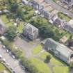 Oblique aerial view of the Roman Catholic Church of St Ninian and St Triduana and 232 Marionville Road, looking ESE.
