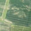 Oblique aerial view of the cropmarks of the settlement at Standingstone, looking SSE.