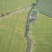 Oblique aerial view of the cropmarks of the West Mains fort, looking SSE.