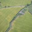Oblique aerial view of the cropmarks of the West Mains fort, looking NE.