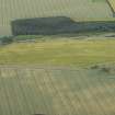 Oblique aerial view of the cropmarks of the fort, looking N.