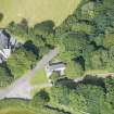 Oblique aerial view of Cairness House South Lodge and St Columba's Episcopal Church, looking W.