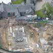 Oblique aerial view of Meldrum House and North Garden House centred on the construction works, looking SSW.