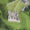 Oblique aerial view of Tolquhon Castle, looking NW.