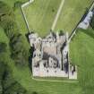 Oblique aerial view of Tolquhon Castle, looking NW.