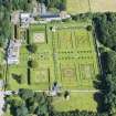 Oblique aerial view of Pitmedden House and walled garden, looking N.