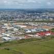 Oblique aerial view of the Altens Industrial Estate with Aberdeen in the background, looking NW.