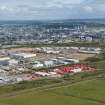 Oblique aerial view of the Altens Industrial Estate with Aberdeen in the background, looking NW.