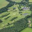 Oblique aerial view of Meldrum House and Golf Course, looking SW.