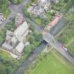 Oblique aerial view of Polwarth Parish Church and Harrison Road Bridge, looking S.
