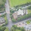 Oblique aerial view of Polwarth Parish Church and Harrison Road Bridge, looking NNW.