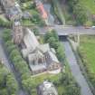 Oblique aerial view of Polwarth Parish Church and Harrison Road Bridge, looking SW.