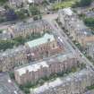 Oblique aerial view of St Peter's Roman Catholic Church and Presbytery, looking NNE.