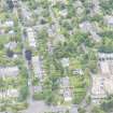 Oblique aerial view of East Morningside House and St Bennets Archiepiscopal Chapel, looking E.