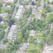 Oblique aerial view of East Morningside House and St Bennets Archiepiscopal Chapel, looking ENE.