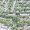 Oblique aerial view of East Morningside House and St Bennets Archiepiscopal Chapel, looking N.