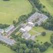 Oblique aerial view of Duddingston House, Offices and Stables, looking NW.