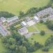 Oblique aerial view of Duddingston House, Offices and Stables, looking WNW.