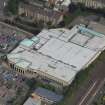 Oblique aerial view of Anniesland shopping centre, looking NNW.