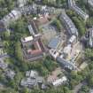 Oblique aerial view of Notre Dame School, looking ENE.