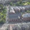 Oblique aerial view of Hyndland Parish Church, looking ESE.