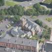 Oblique aerial view of Ruchill Parish Church and Ruchill Parish Church Hall and Janitor's House, looking NNE.