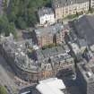 Oblique aerial view of Charing Cross Mansions, looking NE.
