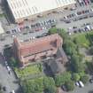 Oblique aerial view of the St Columba's Roman Catholic Church, looking E.
