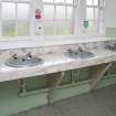 Ground Floor General view of wash hand basin's in Gents showing marble wash stand.