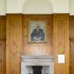 Ground Floor General view of fireplace at West end of Great Hall and portrait above.