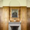 Ground Floor General view of fireplace at East end of Great Hall and portrait above.