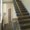 General view of back stairs showing ironwork.