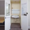 First Floor, General view of wash hand basin fitted in cupboard.