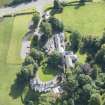 Oblique aerial view of Peel Lodge, Tower House and Stables, looking SE.
