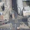 Oblique aerial view of the Trongate Tolbooth Steeple, Mercat Building and Mercat Cross, looking NNE.