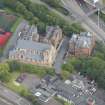 Oblique aerial view of St Mungo's Roman Catholic Church and Martyrs' Public School, looking ENE.