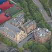 Oblique aerial view of St Mungo's Roman Catholic Church and Martyrs' Public School, looking NE.